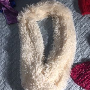 cream scarf, pink scarf and red beanie